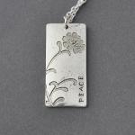 Oxidized silver tone flower..